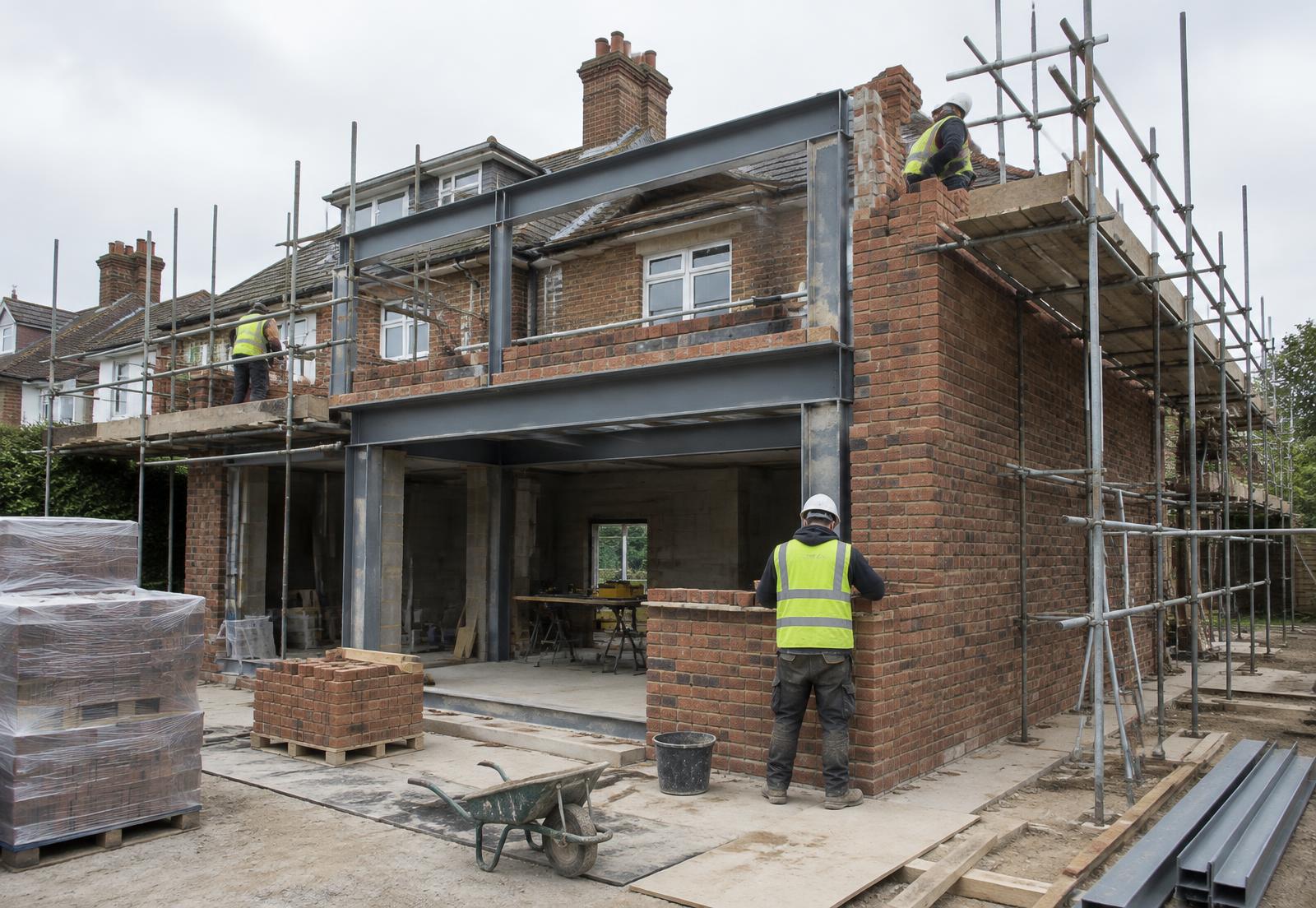 Builders working on a substantial double storey extension